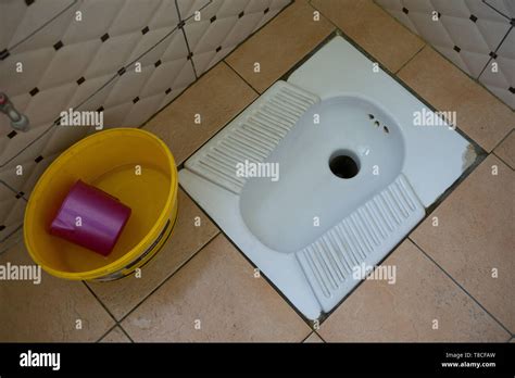 A Traditional Squat Toilet Hole In The Ground In A Petrol Station In