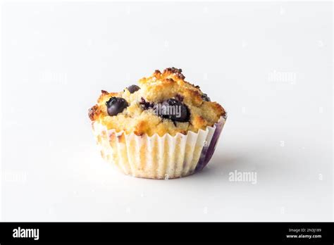 A Single Isolated Homemade Blueberry Muffin Against A White Background