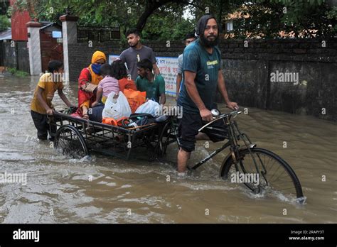 People Make Their Way During Heavy Rainfall Incessant Rains For The