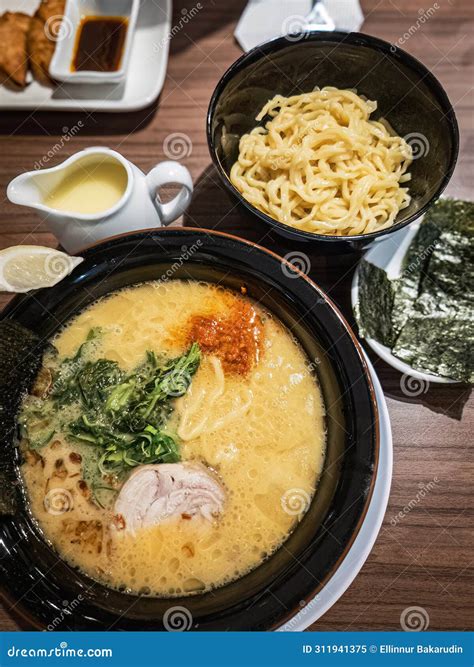 Japanese White Broth Ramen Served with Extra Noodle and Seaweed. Top