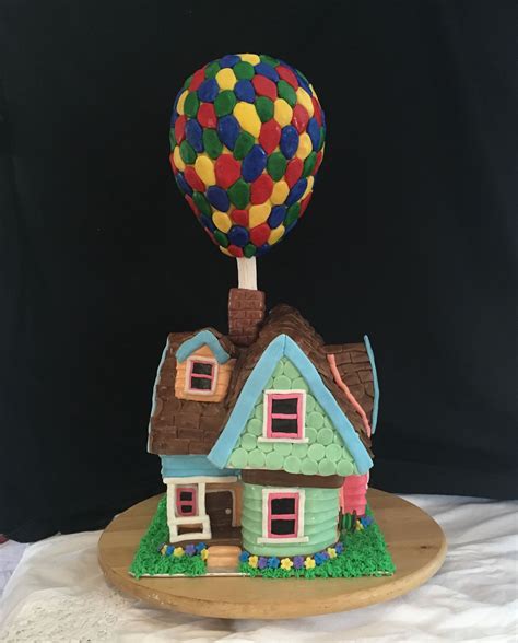 A Cake Shaped Like A House With A Hot Air Balloon On Top