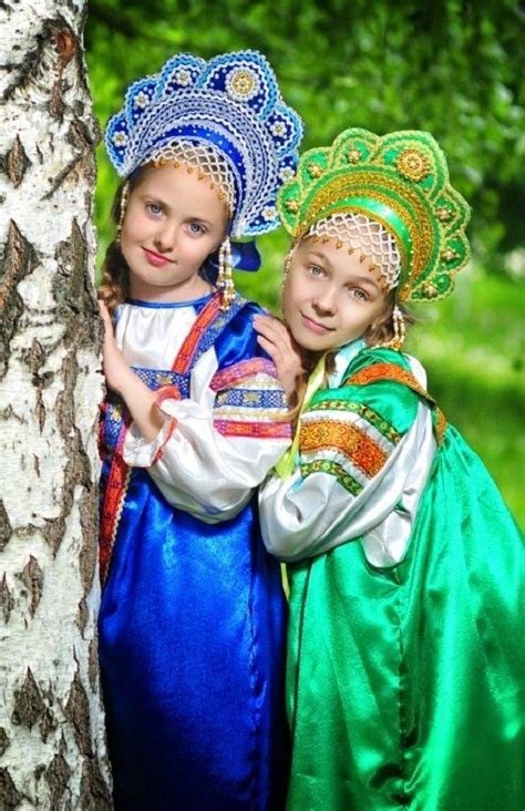 Two Russian girls in traditional costumes and in headdresses "Kokoshnik ...