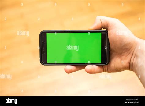 Male Hand With Smartphone Chroma Key Place For Your Advertisement