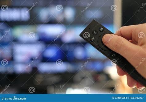 Holding A Tv Remote Control And Switching Channels Stock Photo Image