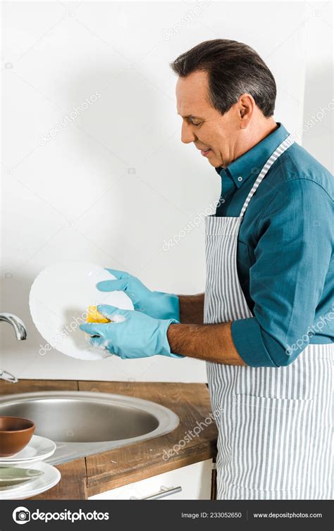 Handsome Mature Man Washing Dishes Kitchen — Stock Photo © Igorvetushko