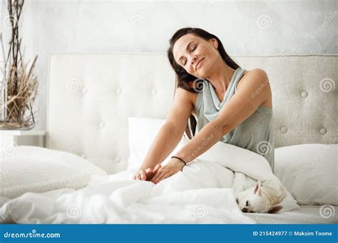 Lazy Morning Concept Beautiful Happy Woman Wakes Up In Bed And