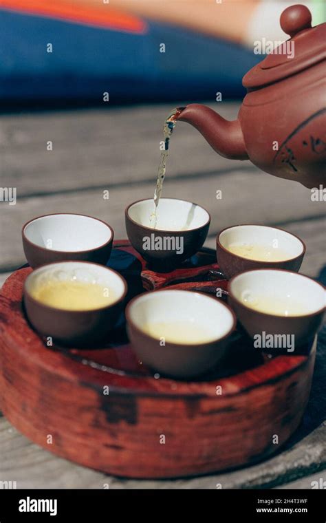 Tea ceremony, Woman pouring traditionally prepared tea Stock Photo - Alamy