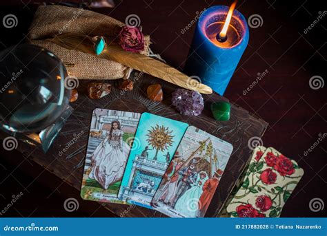 Astrology And Esotericism A Fortune Teller Holds A Fan Of Tarot Cards