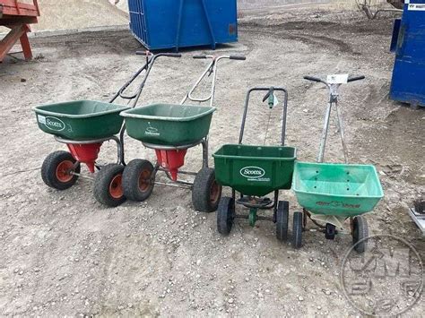 (4) SEED SPREADERS, (2 APPEAR INOP) - Jeff Martin Auctioneers, Inc.