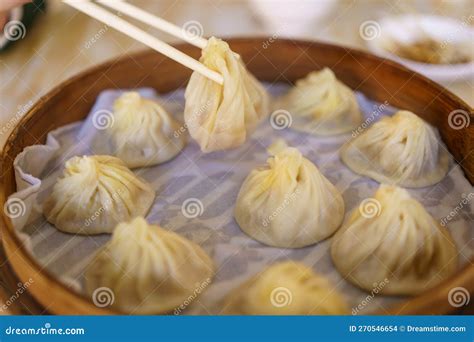 Xiao Long Bao Soup Dumpling Buns With Chopsticks In Restaurant