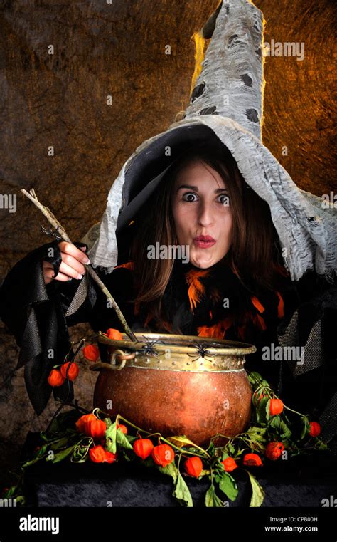 Halloween Witch Cooking In A Copper Boiler Stock Photo Alamy