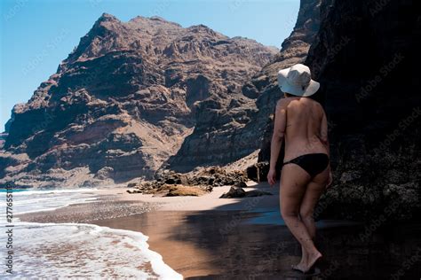 Nude Woman Walking In Scenic Gui Gui Beach In Gran Canaria Island In