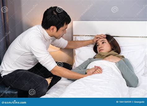 Husband Visiting And Take Care His Sick Wife While She Lying On Bed At