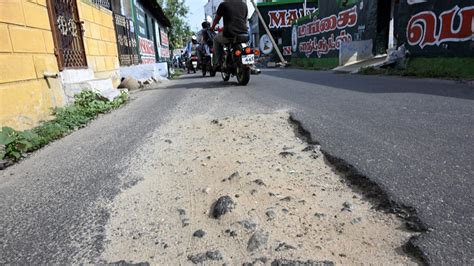 Motorists Residents Demand Fixing Of Pothole Ridden Kollampalayam