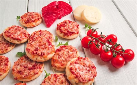 Premium Photo Mini Pizzas Salami With Mozzarella Cheese On A White