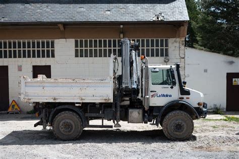 Side View Of A White Mercedes Benz Unimog G5000 Off Road Truck With A