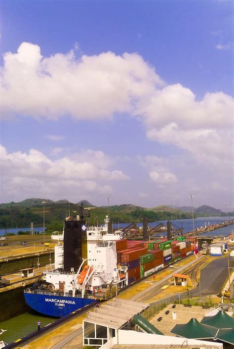 Container Ship And Tugboat Pass Through The Miraflores Locks Panama