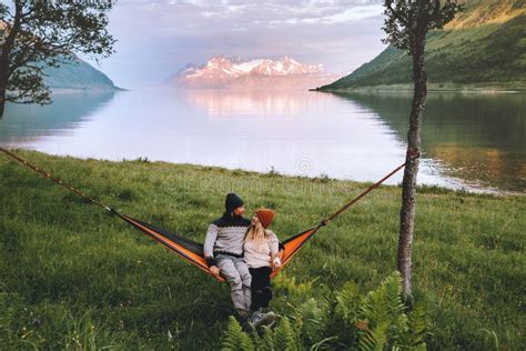 Romantic Couple Relaxing In Hammock Outdoor Man And Woman Traveling