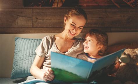 Mother and Child Reading Book in Bed before Going To Sleep Stock Image ...