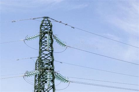 Metal Electric Towers Under A Blue Sky High Voltage Lines And Power