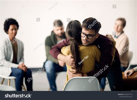 Young Sad Man Hugging Female Participant Stock Photo 1856274172 ...