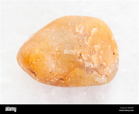 Macro Shooting Of Natural Mineral Rock Specimen Tumbled Yellow