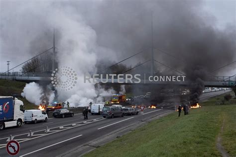 Protesters Set Rubbish On Fire As French Govt Barely Survives No