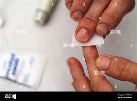 Diabetic Cleaning Finger With Sterile Alcohol Swab For Blood Test Stock