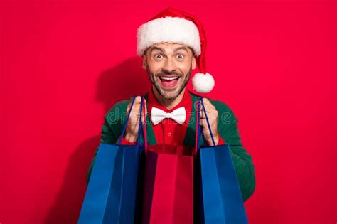 Photo Of Cute Shocked Man Wear X Mas Bowtie Green Cardigan Getting Noel Presents Bargains