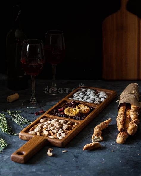 A Long Rectangular Wooden Mini-bar for Snacks on a Table with Wine ...