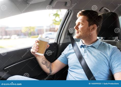 Man With Takeaway Coffee On Back Seat Of Taxi Car Stock Photo Image