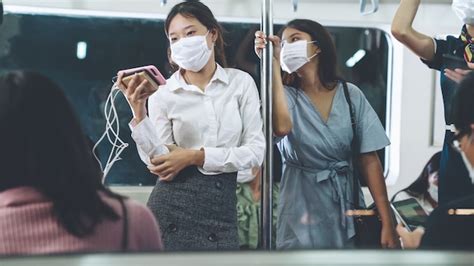 Premium Photo People Wearing Face Masks On A Crowded Public Subway Train