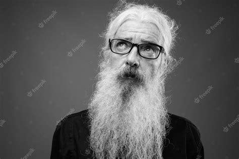 Premium Photo Portrait Of Senior Bearded Man Wearing Black Shirt On