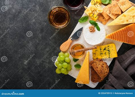 Assortment Of Cheese Honey Cracker Blueberries Grapes With Red And