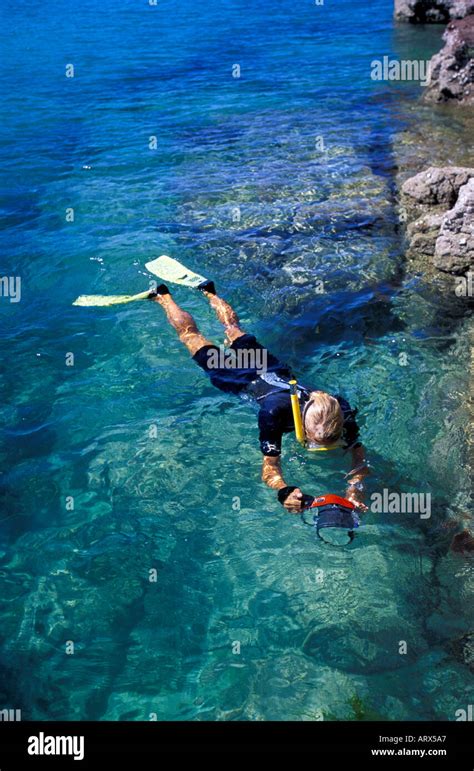 Woman Snorkeler With Underwater Camera In Azure Blue Waters Island Of