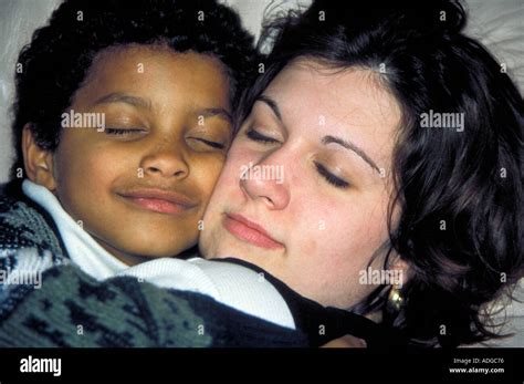 Woman hugging Child Stock Photo - Alamy