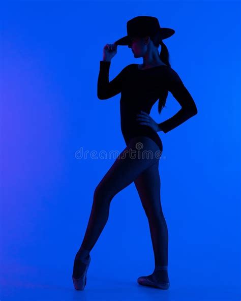 Contemporary Ballet Dancer Woman In Hat Posing On Blue Background Professional Ballerina In