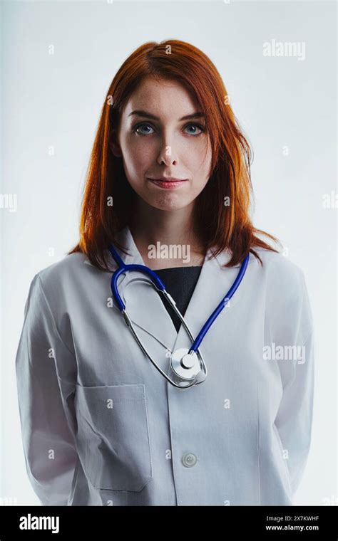 Red Haired Female Doctor Wearing A White Lab Coat And A Stethoscope