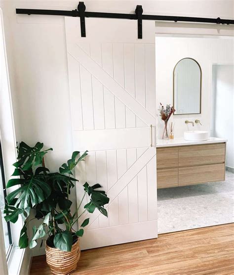 sliding barn door opens  reveal bathroom soul lane