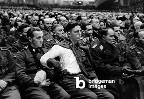 Image Of A Large Group Of People Listen To The Speech By