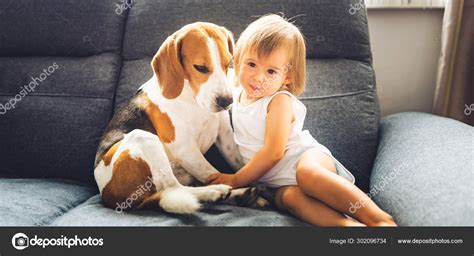 Puppies Cuddling Baby