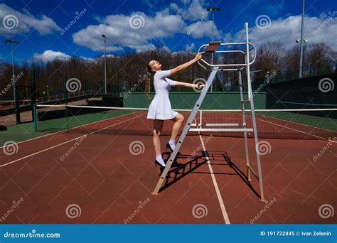 Sensual Woman With Tennis Racket At Net On Lawn Activity Energy