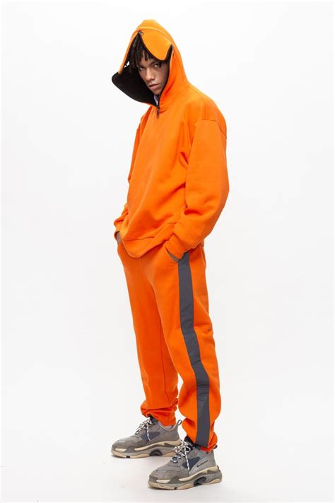 Orange pants with reflective stripes Roussin. Оранжевые штаны со ...