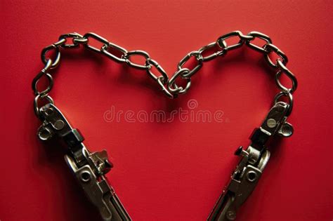 Unbreakable Bond A Heart Shaped Metal Chain Connected By Jumper Cable