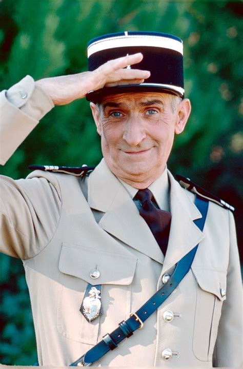 A Man In Uniform Saluting With His Hand On The Top Of His Hat