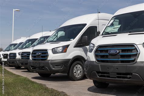 Ford E-Transit Cargo Van display at a dealership. Ford offers the E ...