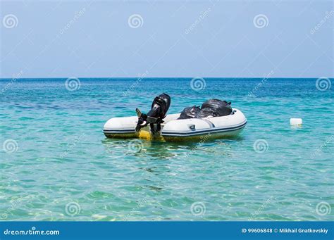 Inflatable Dinghy Boat On A Blue Sea Water Royalty Free Stock