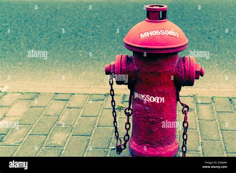 Red Fire Water Hydrant Beside The Road Hipster Filter And Noise Grain