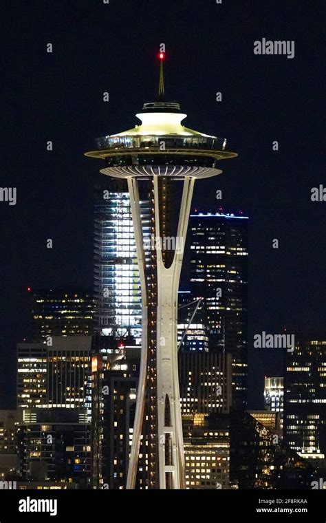 Night scene of Seattle in Washington, USA, with Space Needle Tower and other buildings light up ...