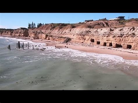 Low Flying Drone Over Port Willunga Jetty Pylons And Cliff Caves On A